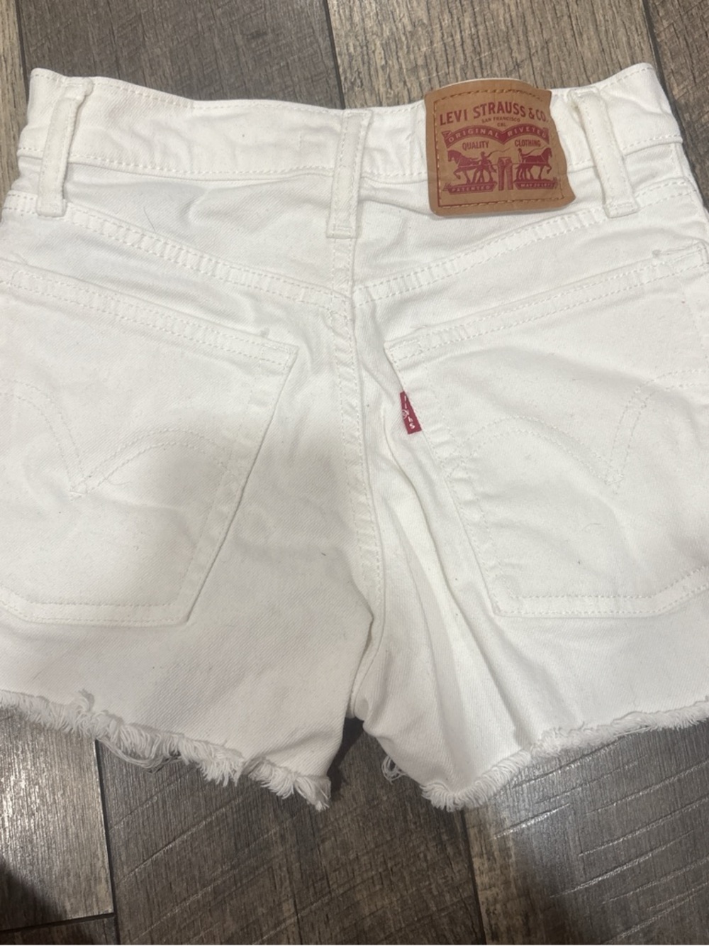 Levi's White Distressed Cutoff Denim Shorts - Picture 2 of 3